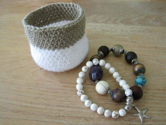 crochet mini basket next to bead bracelets
